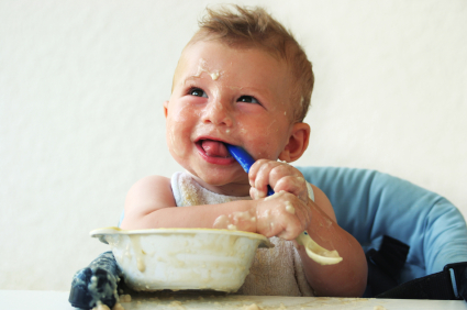 baby with bowl and spoon organic baby food glass bottles